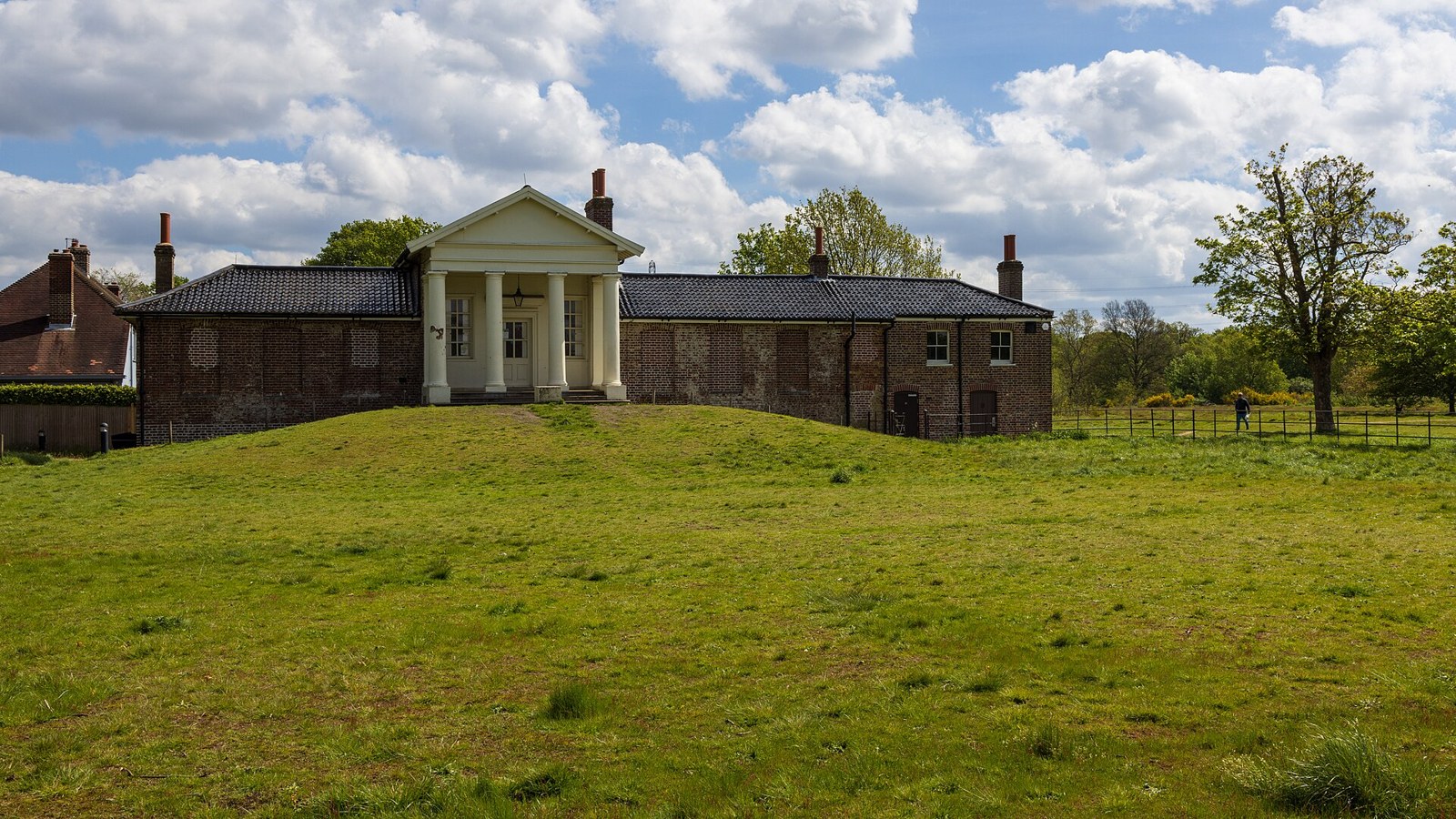 The Temple, a Georgian garden building, seen across the grass in Wanstead Park