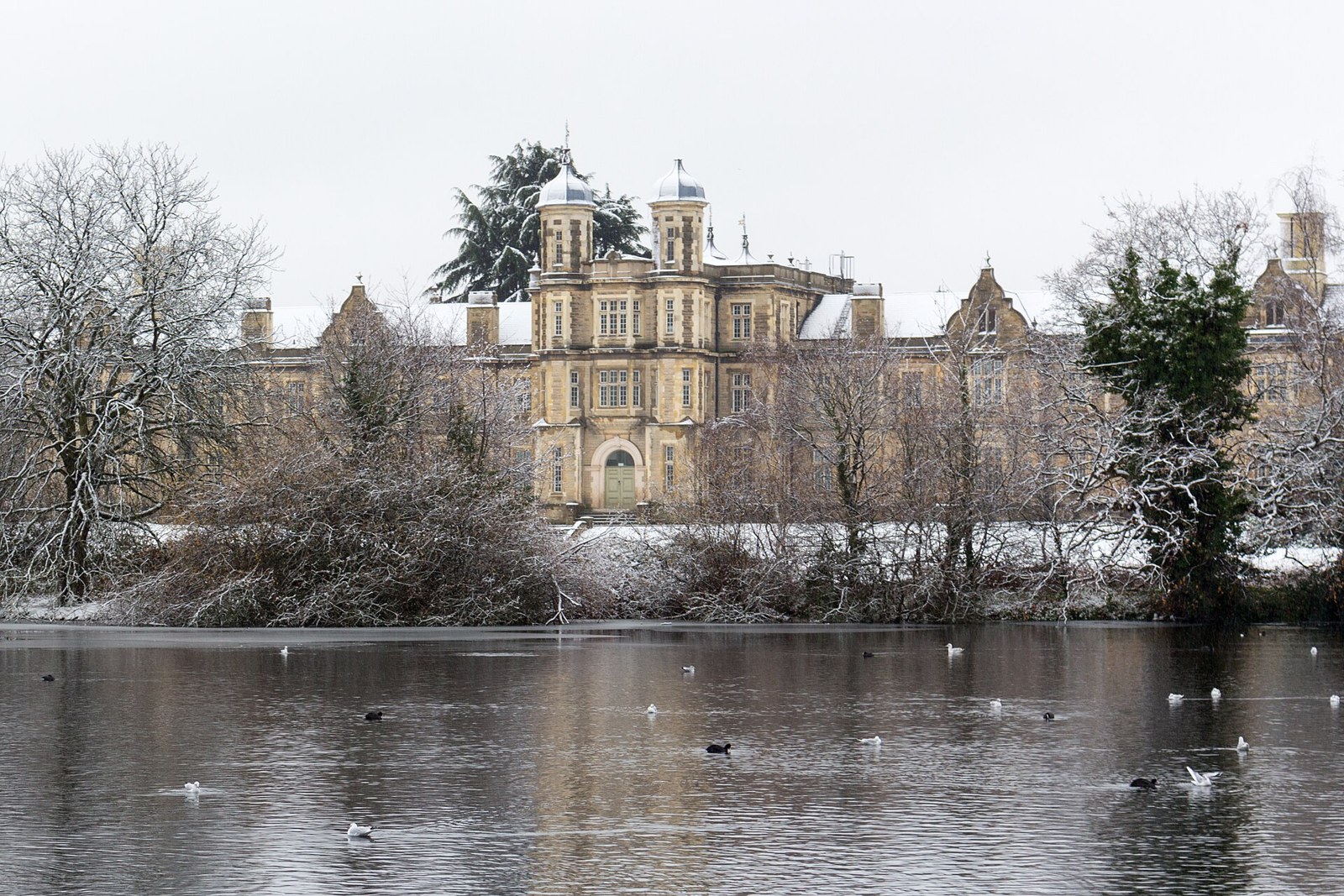 Snaresbrook Crown Court seen across Eagle Pond in winter