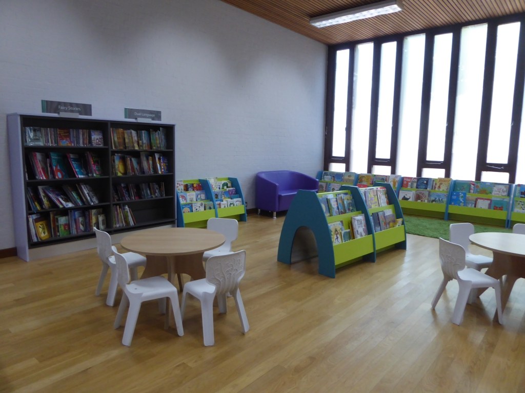 The children’s area inside Wanstead Library, with low shelves and small tables