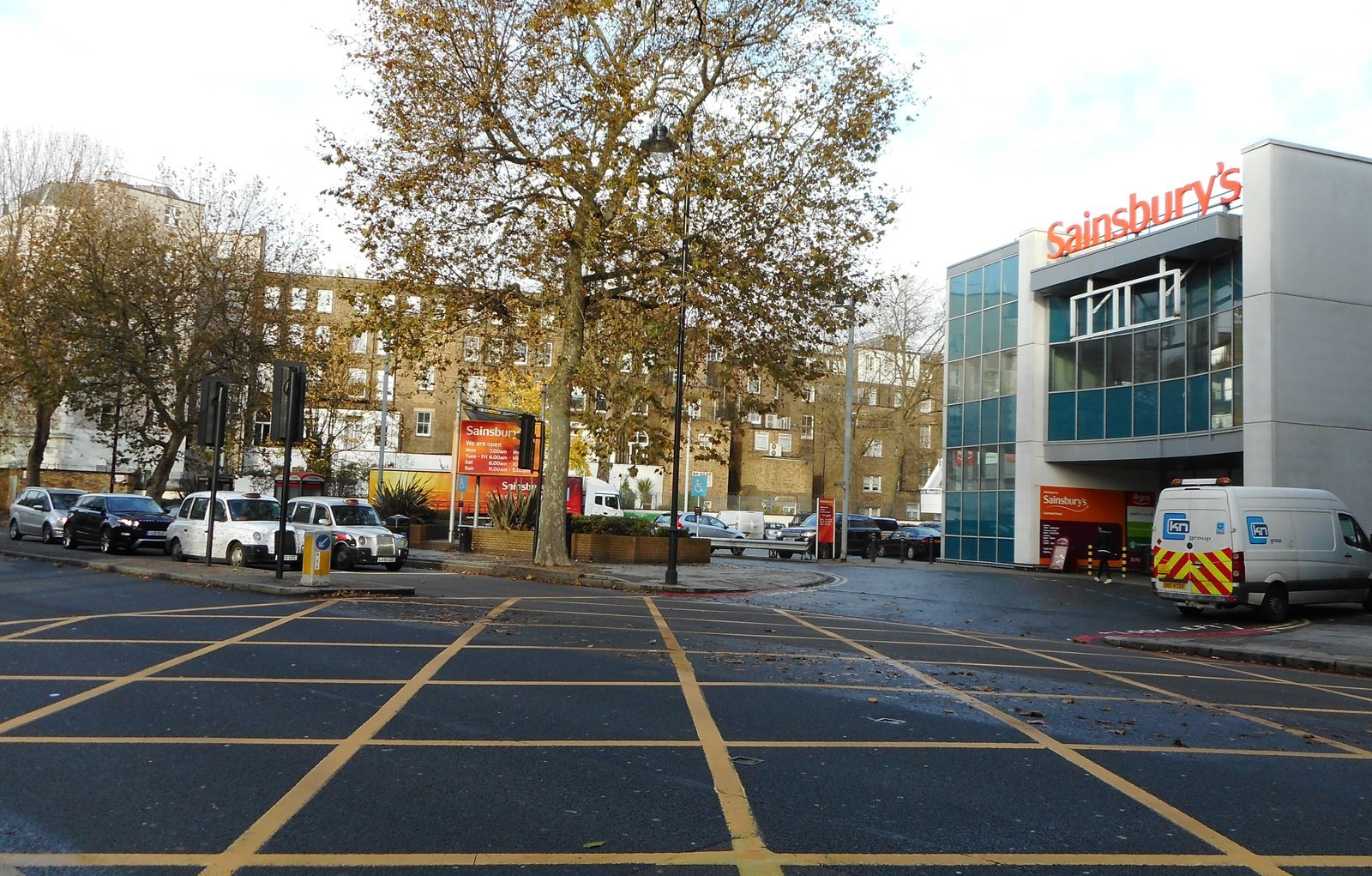 A yellow box junction marked on the road surface