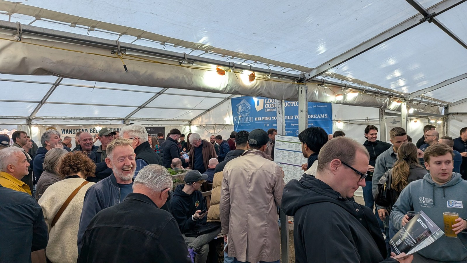 Drinkers crowded under the marquee roof at the Wanstead Beer Festival